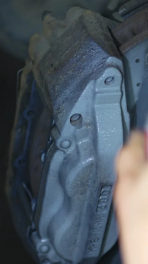 Close-up of a dirty rusty multi-piston car brake caliper assembly. Stock Footage 344363420