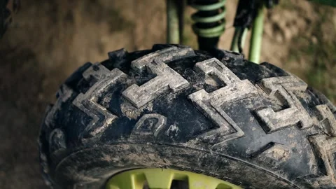 Close-up of the dirty spiked ATV wheel after the race. Close-up shooting Video stock 340652661
