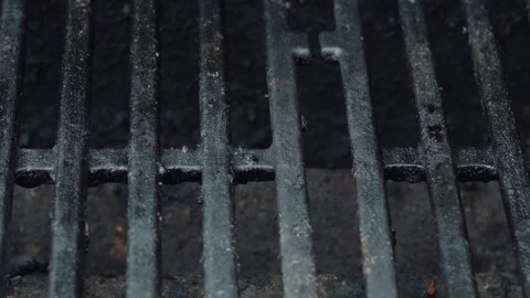 Close-up of Dirty, Used Grill Grates Being Heated Up During a Summer Cookout Stock Footage 313636615