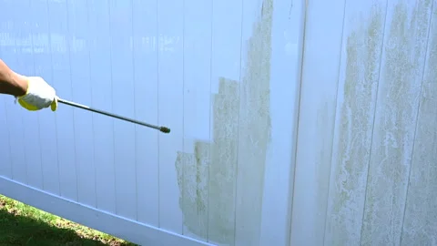 Close up of dirty white vinyl siding and high pressure power washer. Professi Stock Footage 180648590