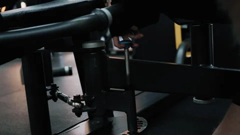 Close-Up of Disabled Athlete Adjusting Weights on Leg Machine 库存影片 322016168
