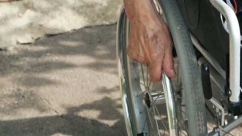 Close-up Of A Disabled Man Pushing Wheel Of Wheelchair Stock Footage 94478428