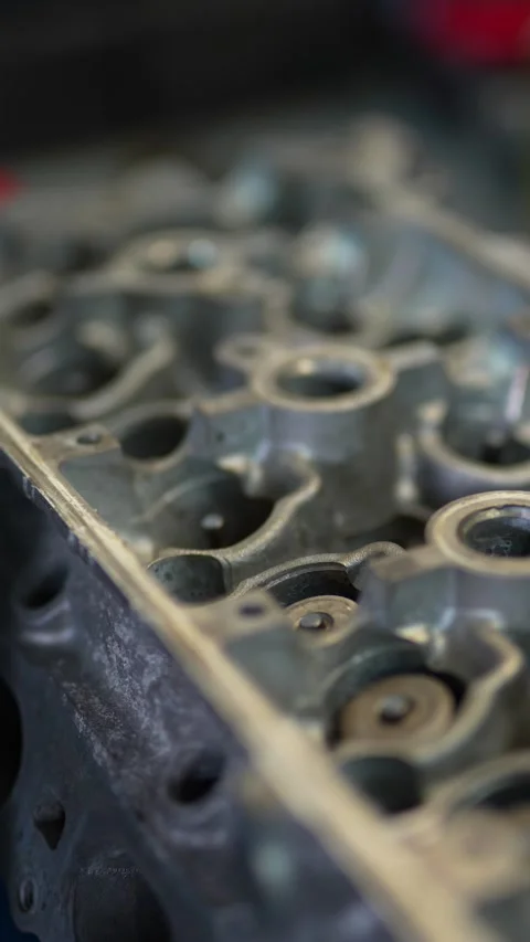 Close-up of disassembled aluminum engine cylinder head with valve springs Stock Footage 331940927