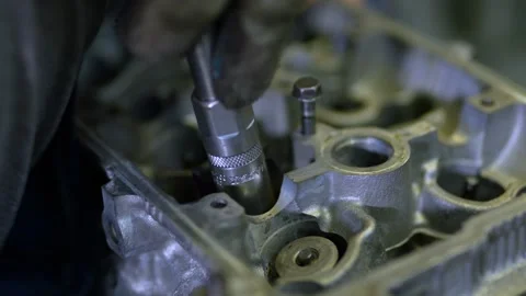 Close-up of disassembled aluminum engine cylinder head with valve springs Stock Footage 331940970