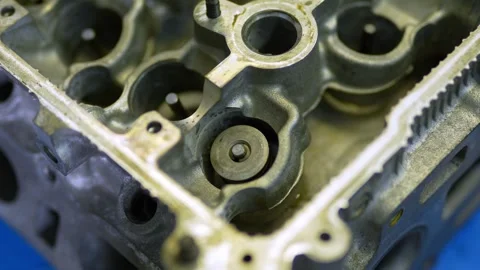 Close-up of disassembled aluminum engine cylinder head with valve springs Stock Footage 331942232