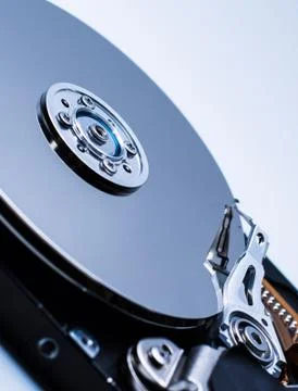 Close up of a Disassembled computer hard drive on white isolated background w Stock Photos