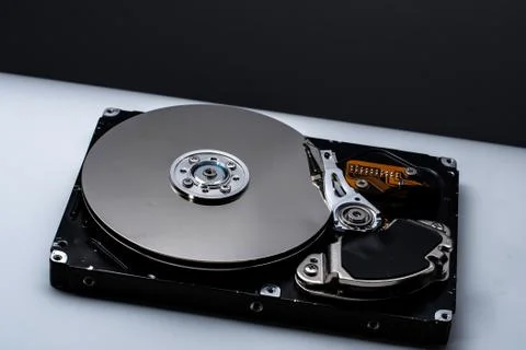 Close up of a Disassembled computer hard drive on white isolated background w Stock Photos