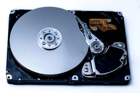 Close up of a Disassembled computer hard drive on white isolated background w 库存照片