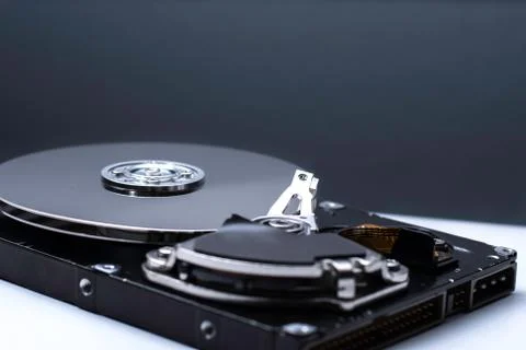 Close up of a Disassembled computer hard drive on white isolated background w Stock Photos