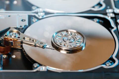 Close up of disassembled hard disk with abstract reflection Stock Photos