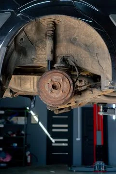 Close-up of disassembled machine part for work with installation by bolts car on Stock Photos