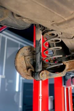 Close-up of disassembled machine part for work with installation by bolts car on Stock Photos