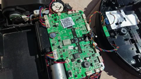 Close-up of a disassembled robot vacuum showing its internal components Stock Footage 336505321