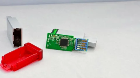 Close-up of a disassembled USB flash drive on a white background, revealing.. Stock Footage 261098767