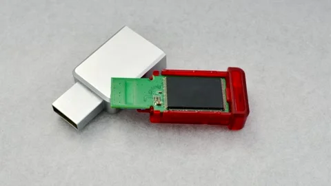 Close-up of a disassembled USB flash drive on a white background, revealing.. Video stock 261098778
