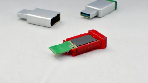 Close-up of a disassembled USB flash drive on a white background, revealing.. Stock Footage 261098848