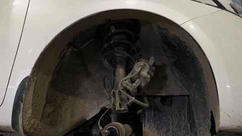 Close-up of a disassembled wheel with a brake pad in a car at a service station. Stock Footage 337734684