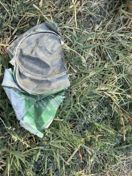 Close Up of Discarded Object and Green Wrapper Stock Photos