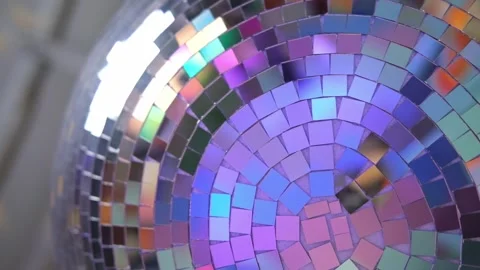 Close-up disco ball hanging on the ceiling. Mirrored sphere reflecting modern Vidéo 346721041