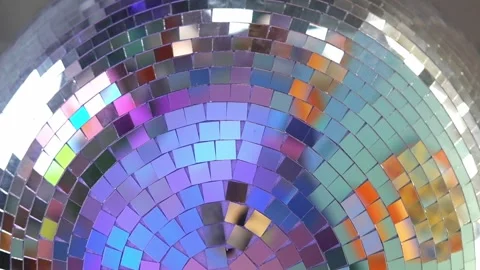 Close-up disco ball hanging on the ceiling. Mirrored sphere reflecting modern Vidéo 346721220