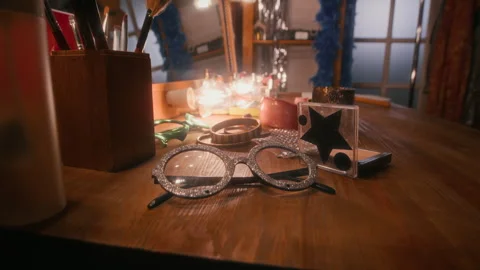 Close-Up of Disco Star Performance Props Lying on Dressing Table Stock Footage 298678686