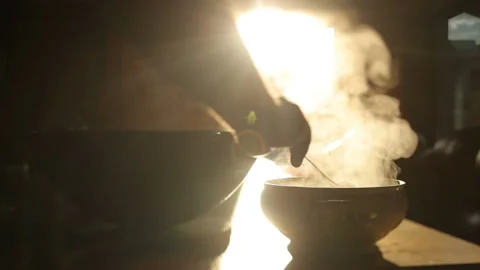 Close to a dish with a cauldron in a saucepan. Pour the soup from the pot into Stock Footage 136084863