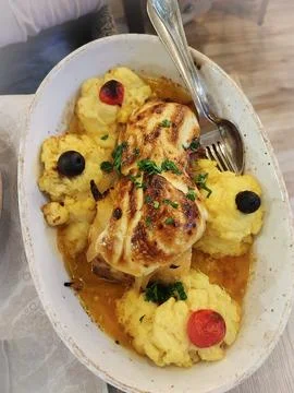 Close up of a dish of cod, bacalhau and potatoes - seafood and home cooking.. Foto stock