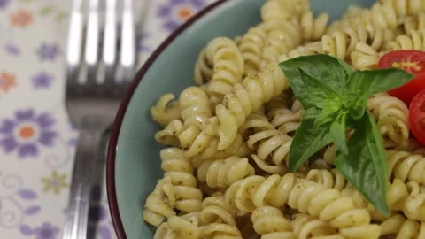 Close-up of a dish of fusilli with pesto Stock Footage 345815965