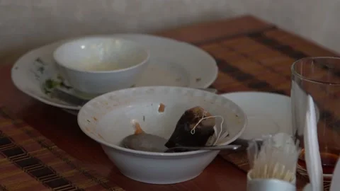 Close-up. dishes after dinner with leftovers. a pile of unwashed dishes. Stock Footage 131761761