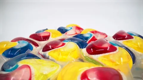 Close up of dishwasher detergent tabs on white background isolated Stock Footage 332124564
