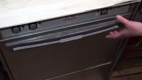  close-up, the dishwasher door opens. pull out the holder with clean plates Stock Footage 131761168
