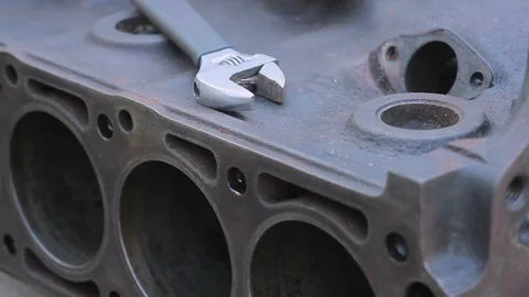 Close-up of a dismantled car engine box and a wrench Stock Footage 88848680