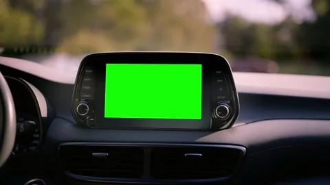 Close up display with green screen on car panel, car driving with navigation Stock Footage 202097326