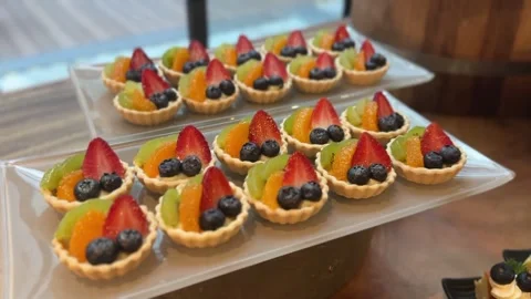 Close up display video of mini fruit tarts arranged on a tray Stock Footage 325417589