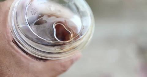 Close-up of a disposable plastic coffee cup sip lid, single-use plastic, ta.. Stock Footage 339386444