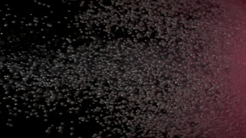 Close-up of Dissolving Pink Bath Bomb in Darkness Stock Footage 274846657