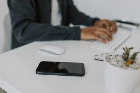 Close up diverse user hands typing on laptop keyboard sitting at white table 4k Stockfoto's