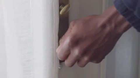 Close up of Diverse Young Man's Hand Opening Front Door Knob in Daylight 動画素材 208750317