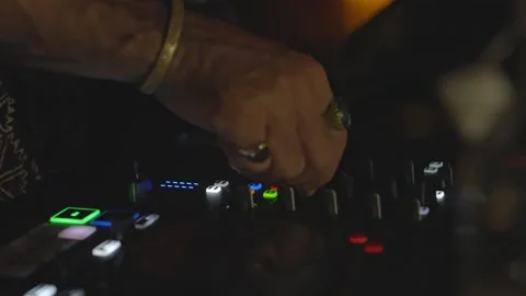 Close-Up of DJ Adjusting Mixer Knobs During Live Performance 스톡 동영상 308894837