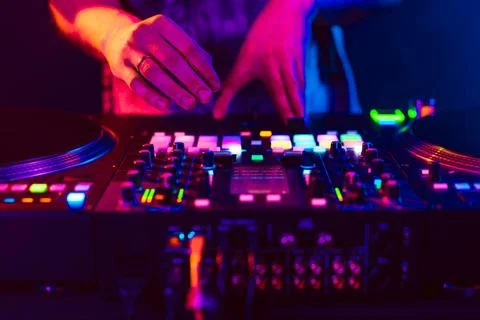 Close up of dj console mixer during concert in the club Stock Photos