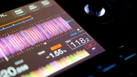 Close Up Of DJ Controller Screen Displaying Audio Waveform.  Professional DJ Dis Stock Footage 335932945