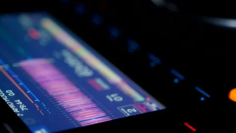 Close Up Of DJ Controller Screen Displaying Audio Waveform.  Professional DJ Dis Stock Footage 335933144