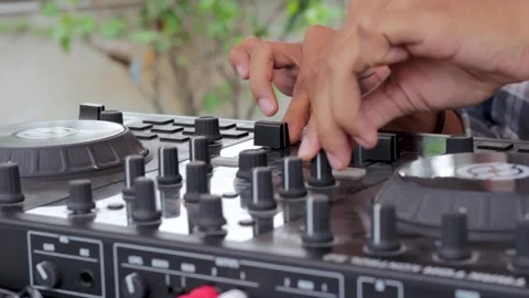 Close up of DJ hands controlling a music table Stock Footage 303832560