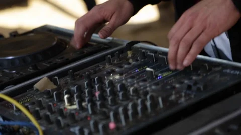 Close up of dj hands mixing and adjusting music at outdoor music festival Stock-Footage 121499486
