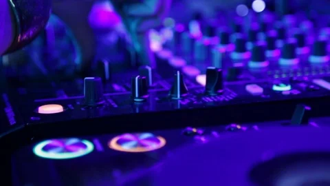 Close up of dj hands mixing and adjusting music at outdoor music festival Stock Footage 121499904