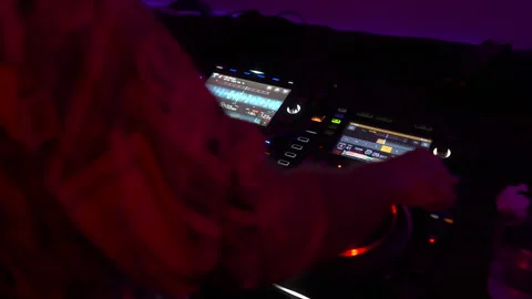 Close Up of DJ Hands Mixing Live Set on Pioneer Decks 4K Video stock 335138426