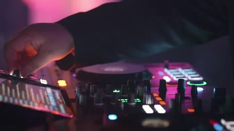 Close Up DJ Hands Mixing Music on Controller Fader at Electronic Party Stock Footage 332090129