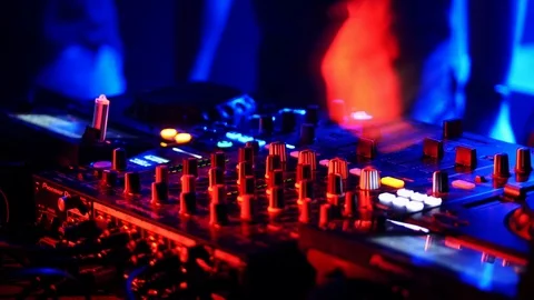 Close-up of DJ hands working on the remote control at night club. Stock Footage 119764967