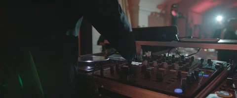 Close-Up of Dj Mixer Controller Desk in Night Club Disco Party. DJ Hands touchin Stock Footage 120204758
