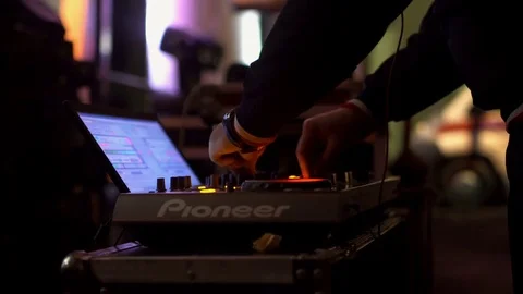 Close-up of the DJ mixing console. A man playing the music. Stock Footage 85055279